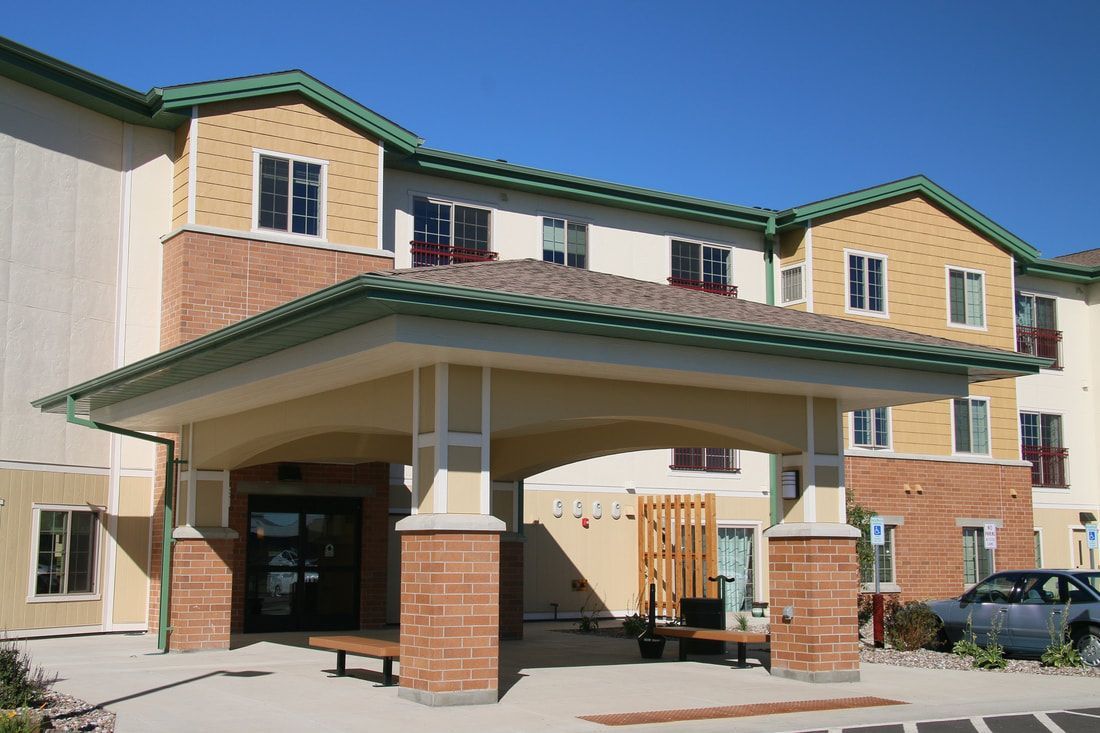 A large apartment building with a green roof