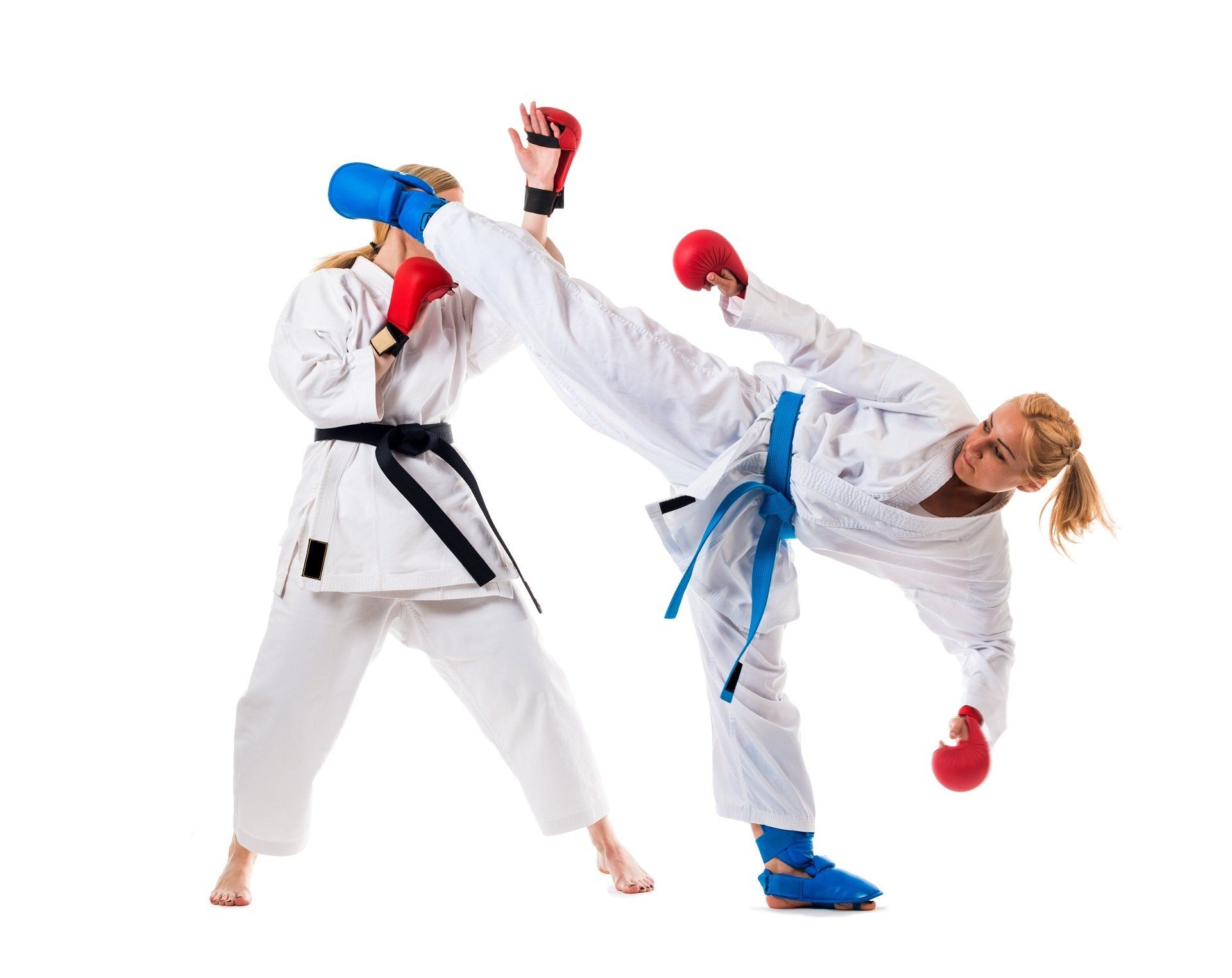 Two martial artists in white gis sparring, one delivering a high kick and the other blocking with red gloves.