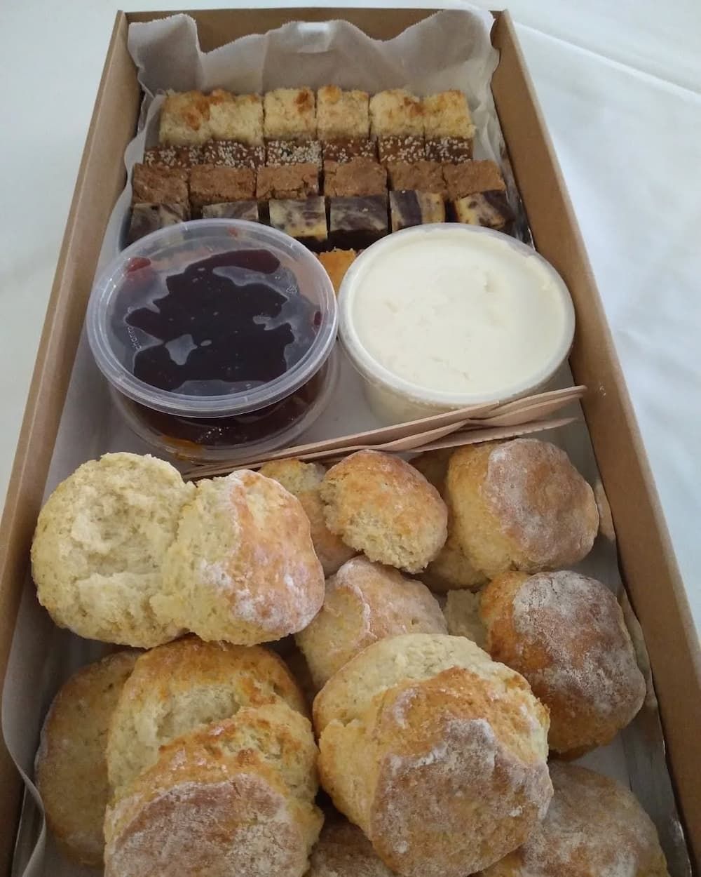 A Box Filled With A Variety Of Pastries And Sauces — Vines at 139 in Grafton, NSW