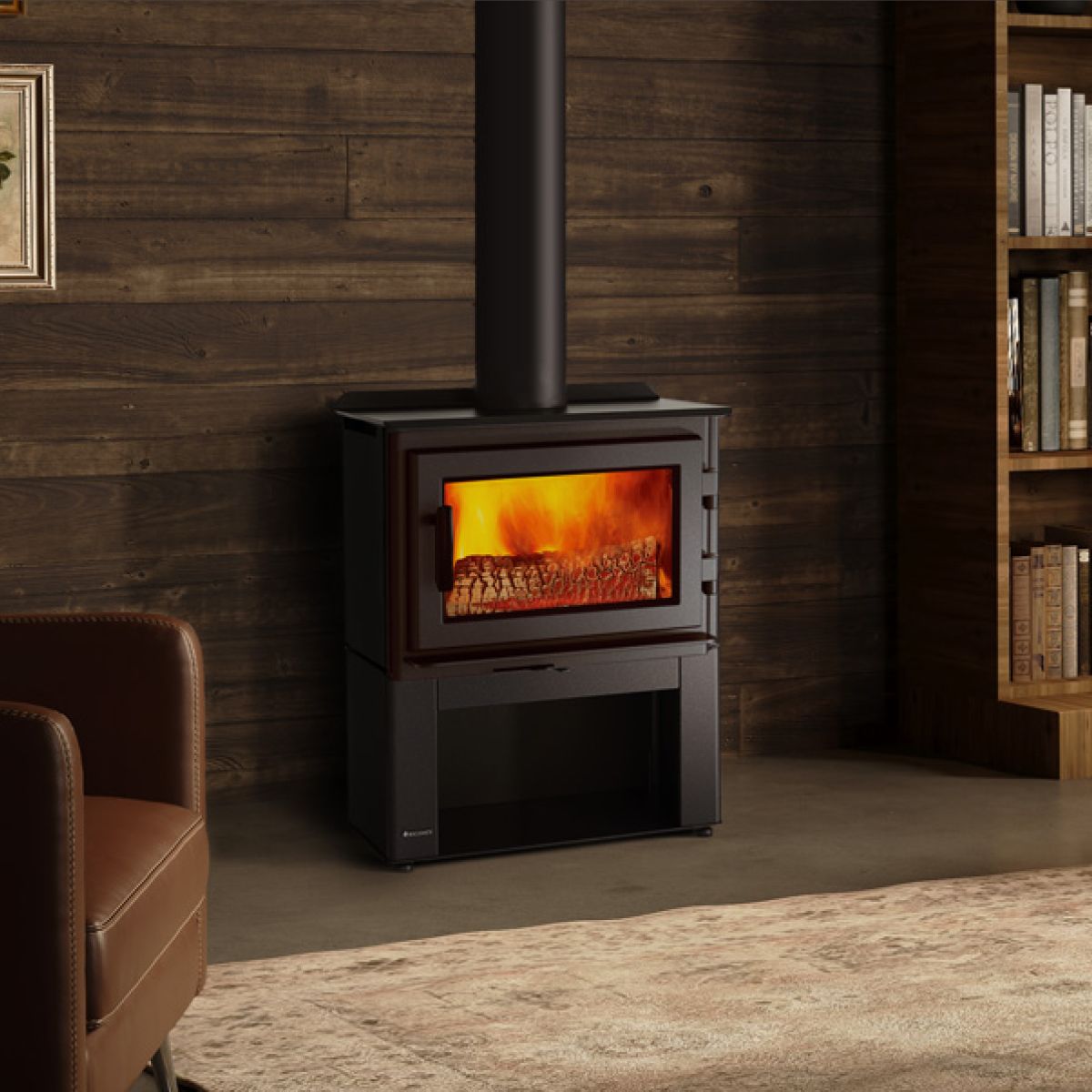Black wood-burning stove with glowing fire in a modern living room with wood-paneled walls and a rug