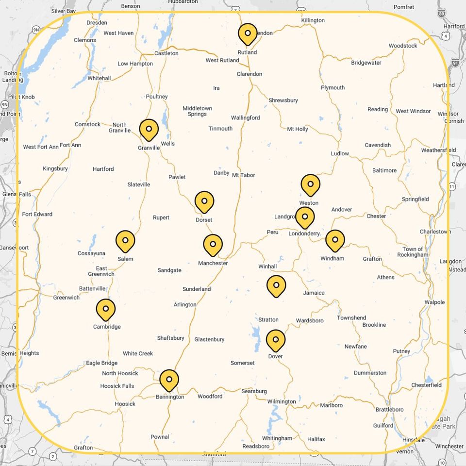 Map with multiple yellow location pins marking points across a green area.