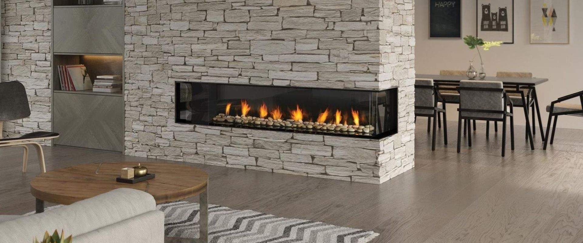 Modern living room with stone fireplace, built-in shelves, and dining area in the background