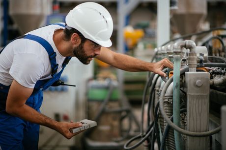 Man Inspecting Machine — Memphis, TN — Industrial Machine & Fabrication, Inc.