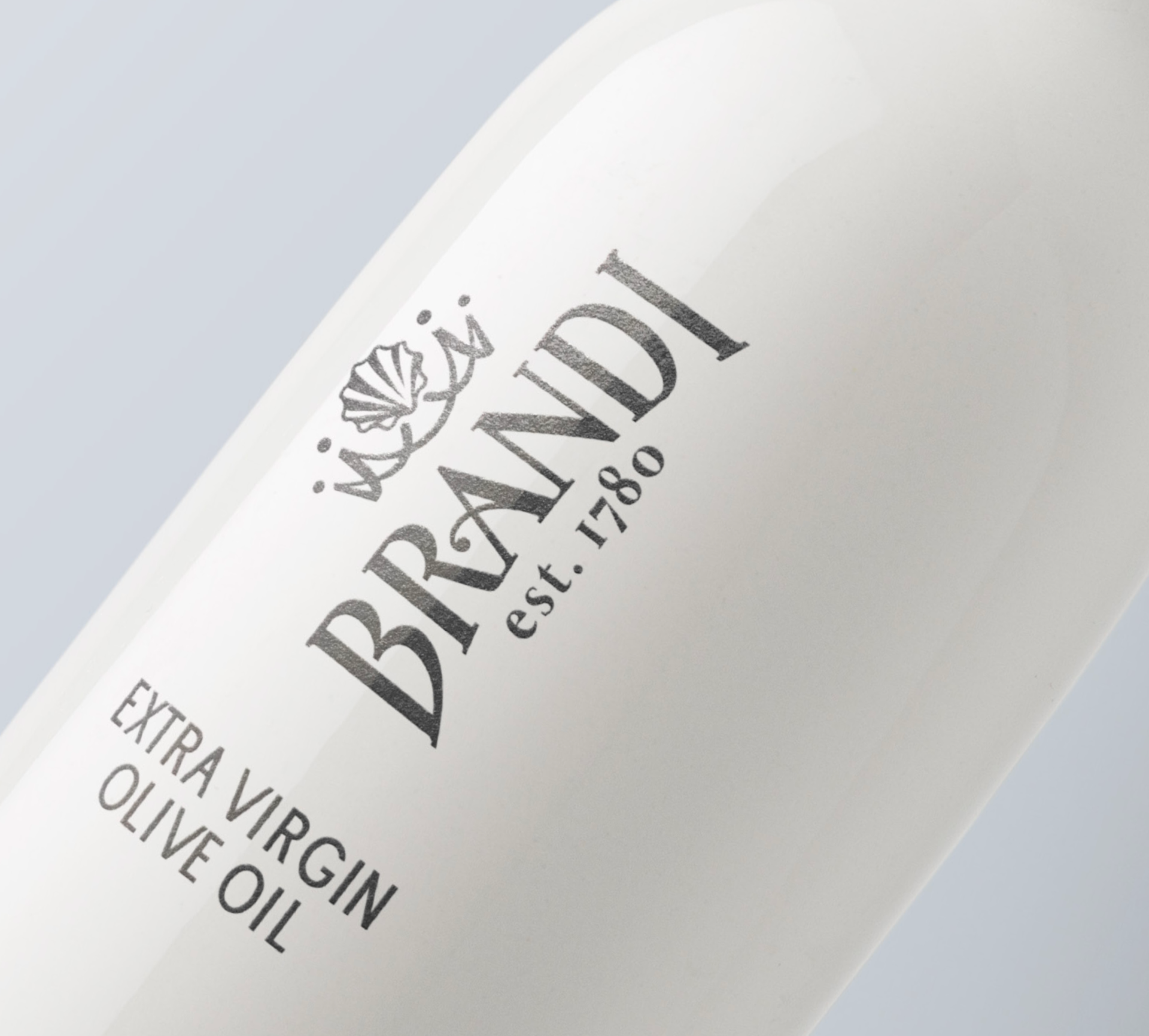 White olive oil bottle with the brand name 