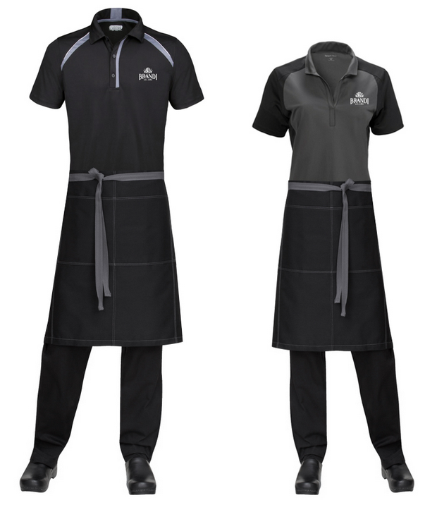 Two people in black uniforms with grey accents and aprons, likely restaurant staff.