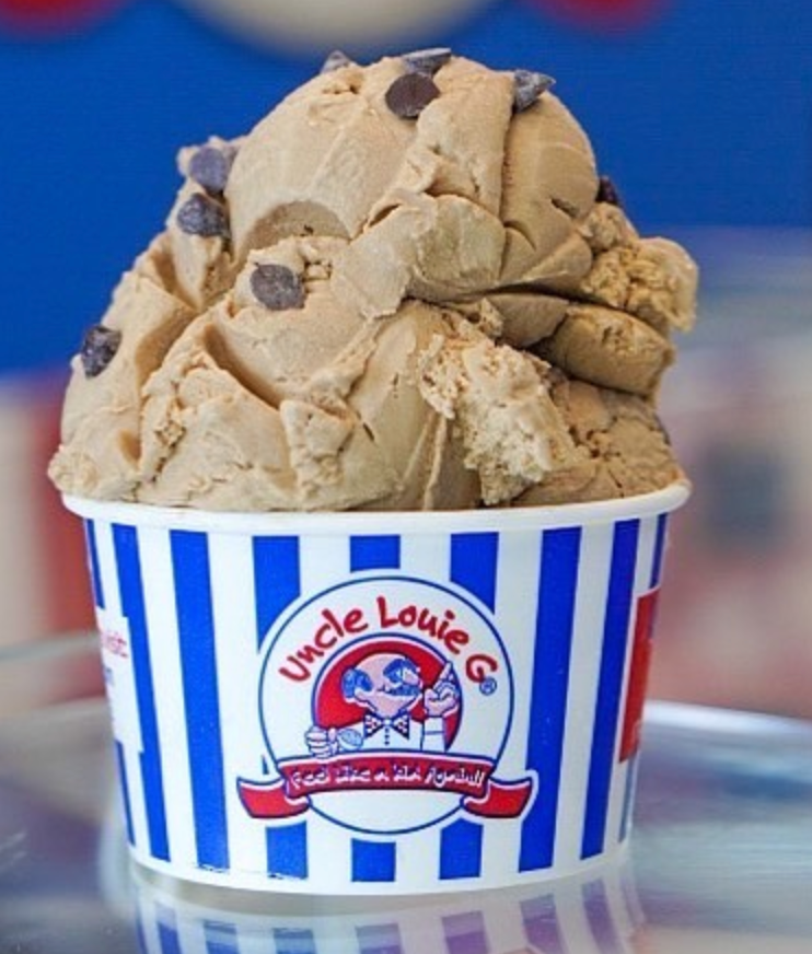 Ice cream in a cup with the Uncle Louie G logo. Coffee-colored ice cream with chocolate chips in a blue and white striped cup.