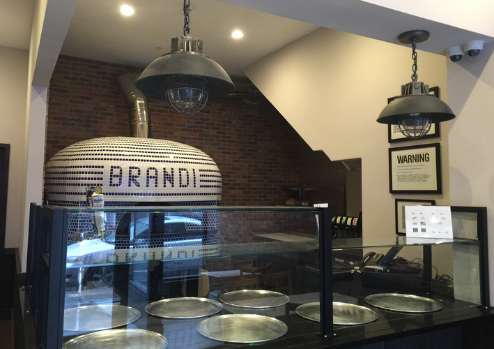 Inside a pizza restaurant: brick oven with 