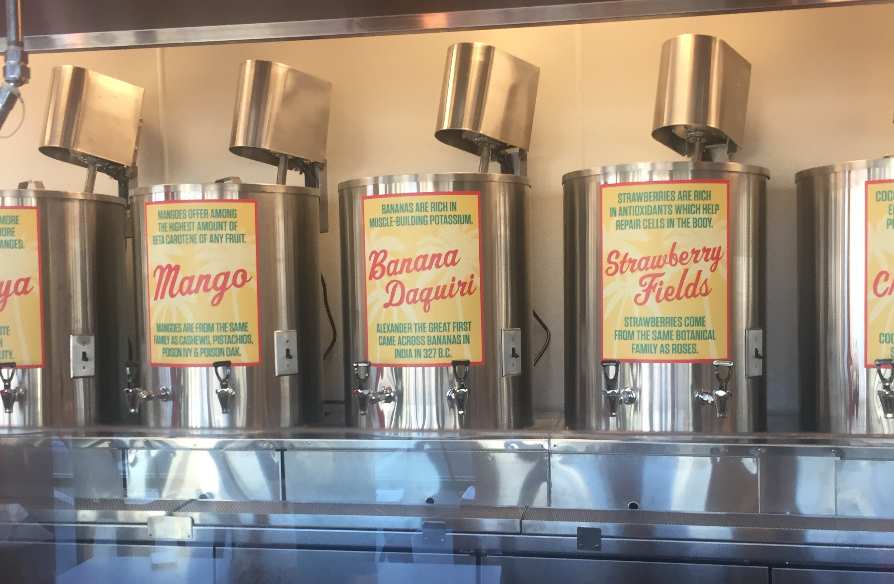 Beverage dispensers labeled: Mango, Banana Daiquiri, and Strawberry Fields.