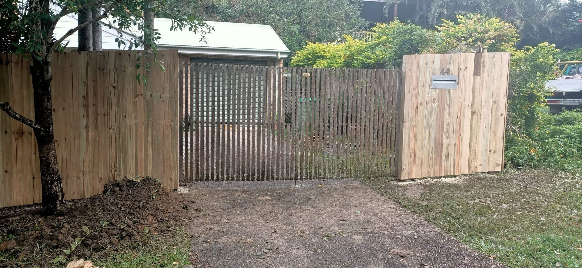 Wooden Gate in a Fence Leading to a Yard — Quality Fences 4 U in Gympie, QLD