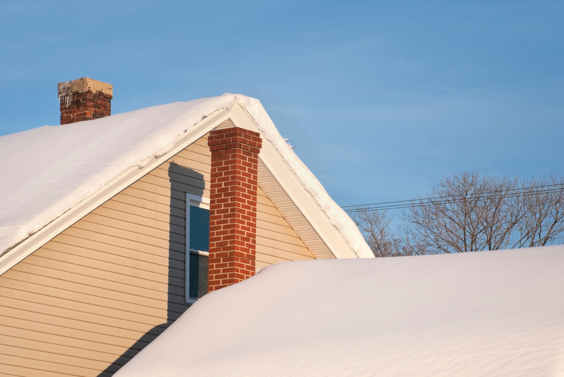 House roof in new snow with chimneys – Macungie, PA - Anytime Todd's Chimney Sweeping