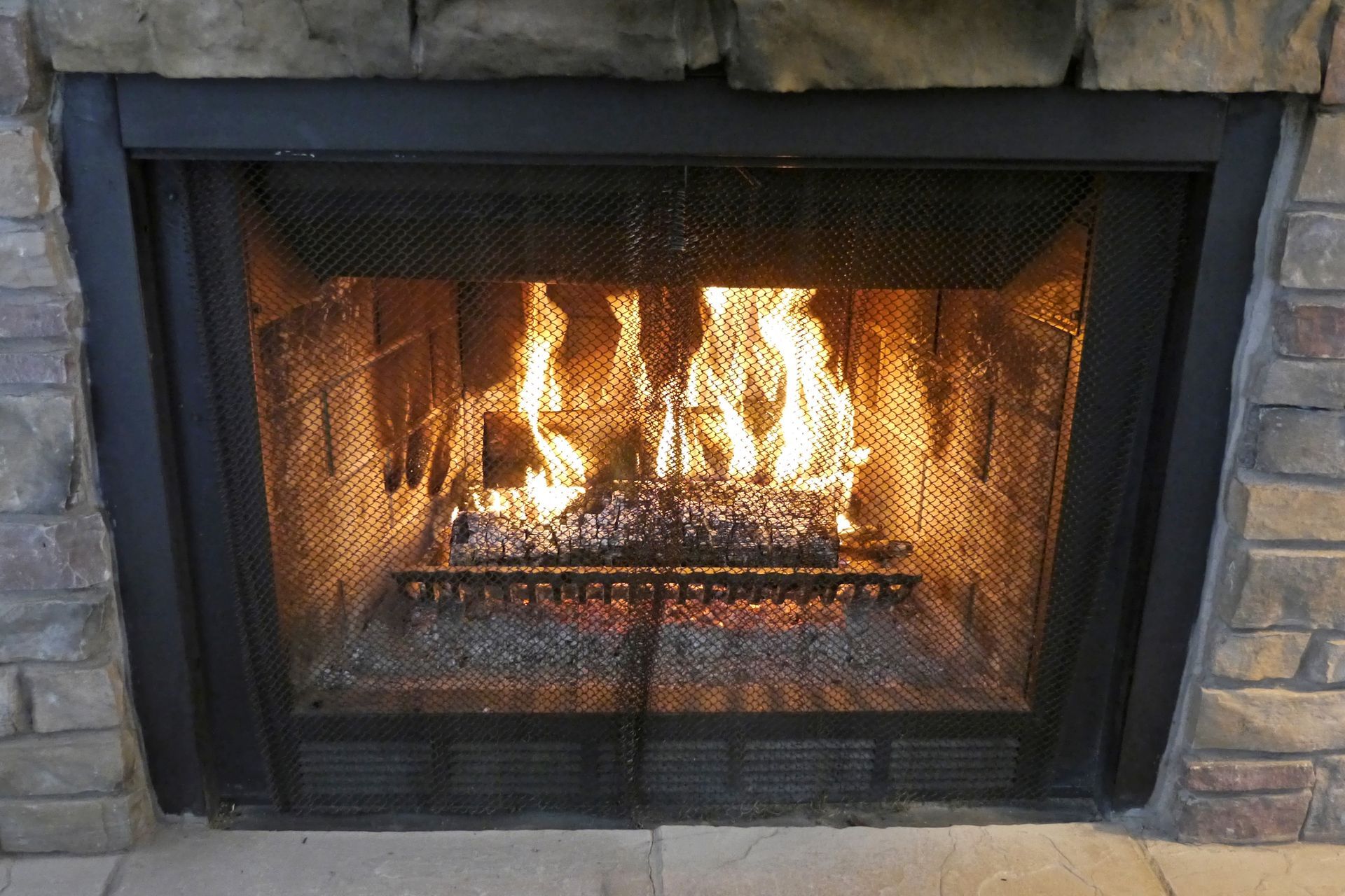 A beautiful view of a fire burning in a wood-burning fireplace in a home – Macungie, PA - Anytime Todd's Chimney Sweeping
