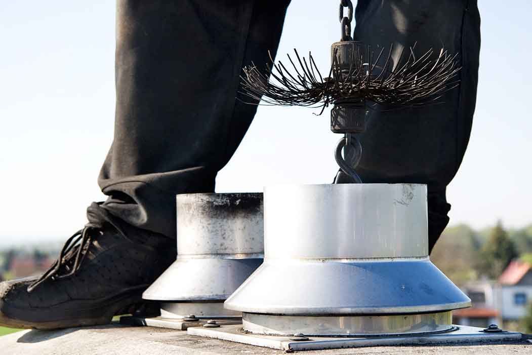 Close up of a chimney sweep on the roof – Macungie, PA - Anytime Todd's Chimney Sweeping