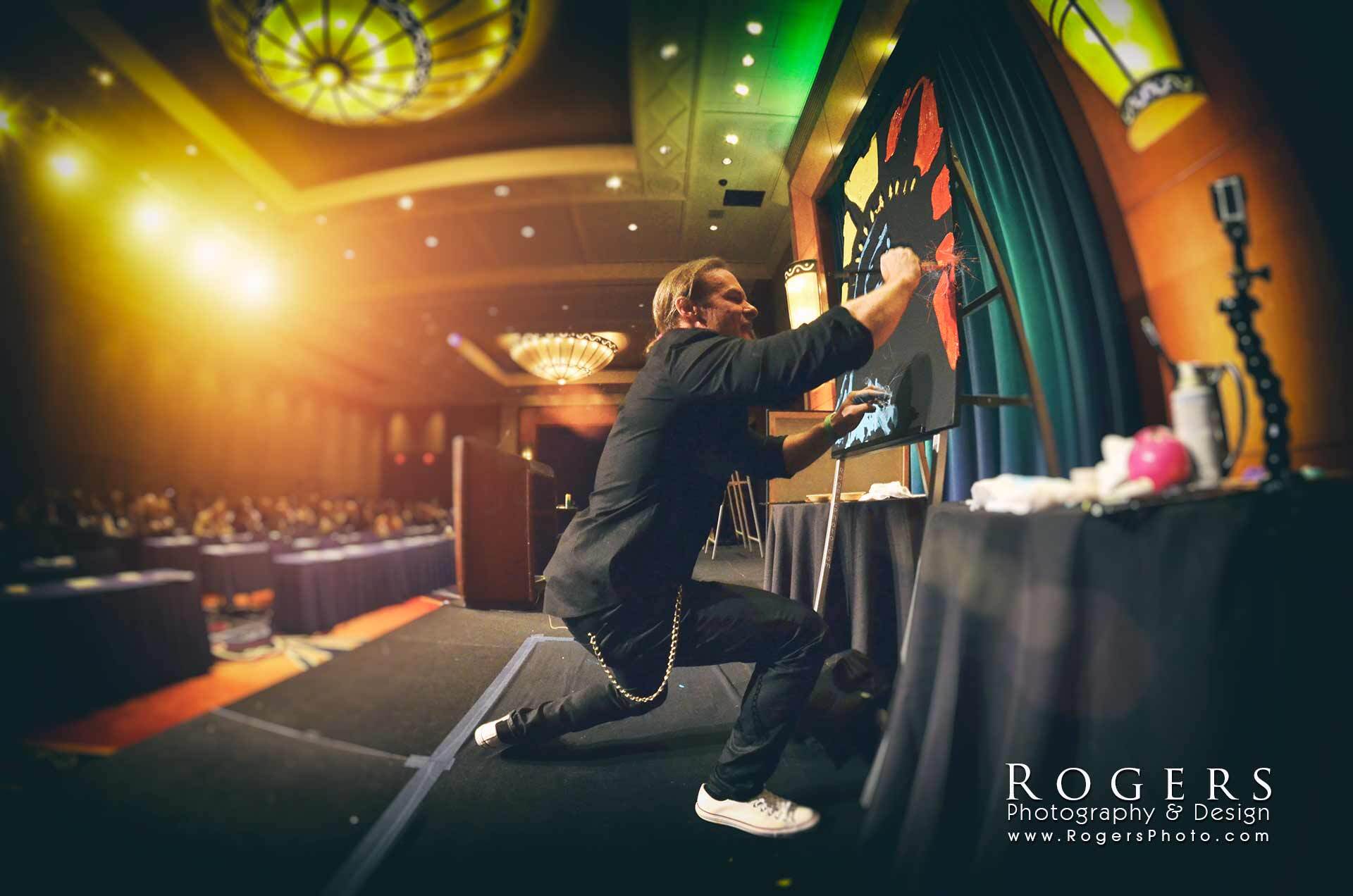 Live artist painting a speed portrait at Mohegan Sun Casino.