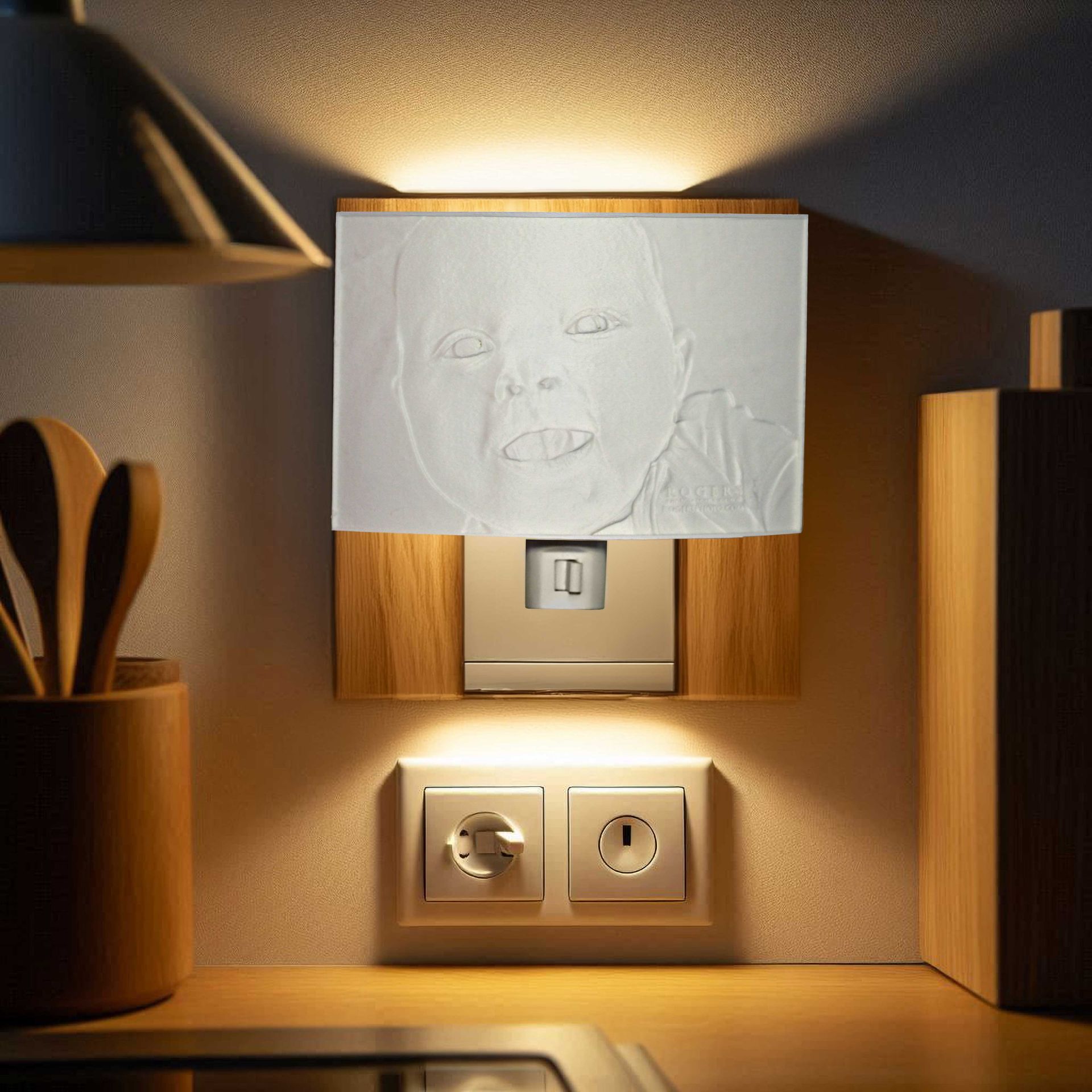 Warmly lit wall with a white note, light switch, and power outlets on wood paneling