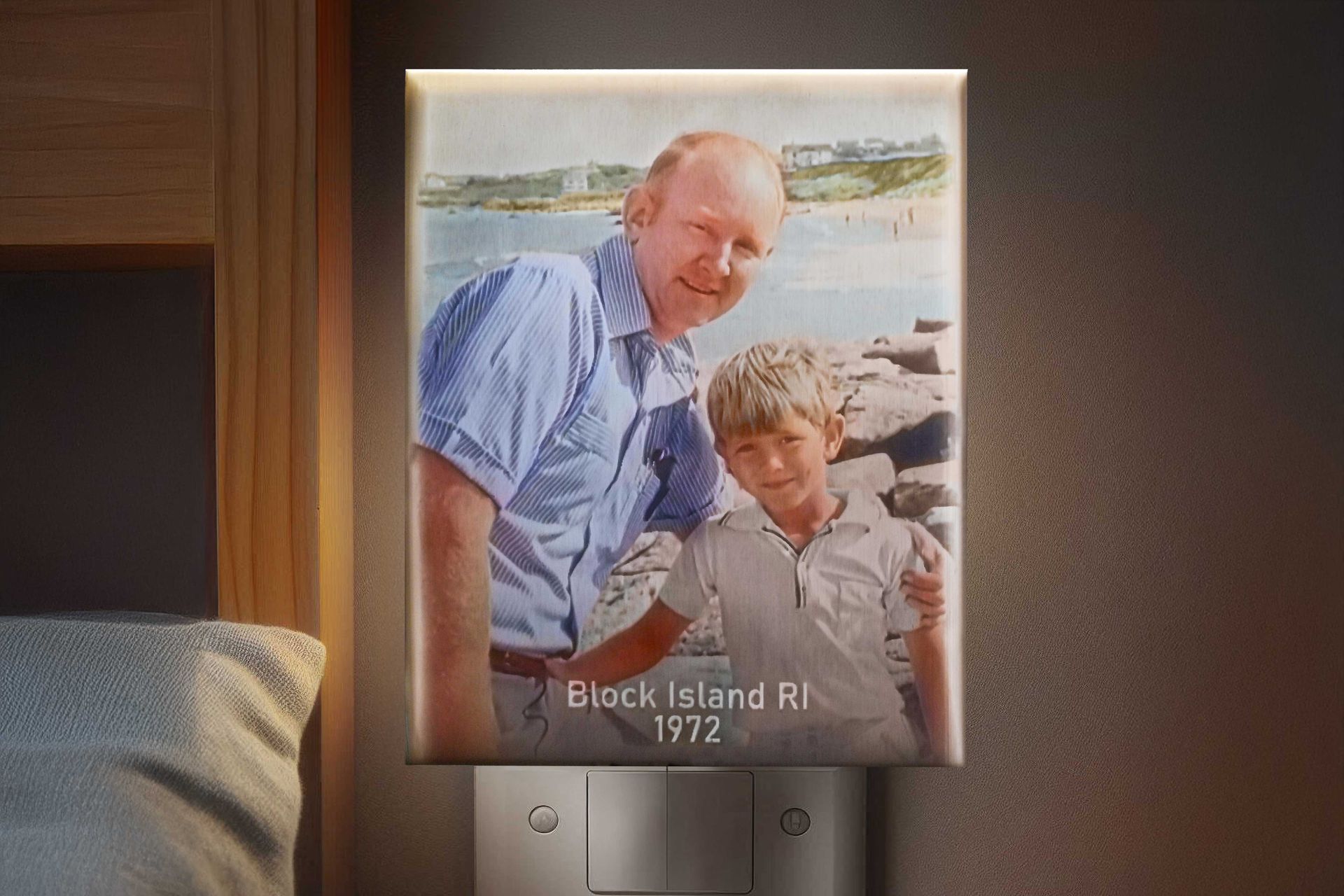 Framed photo of two people by the water, labeled “Block Island, RI 1972.”