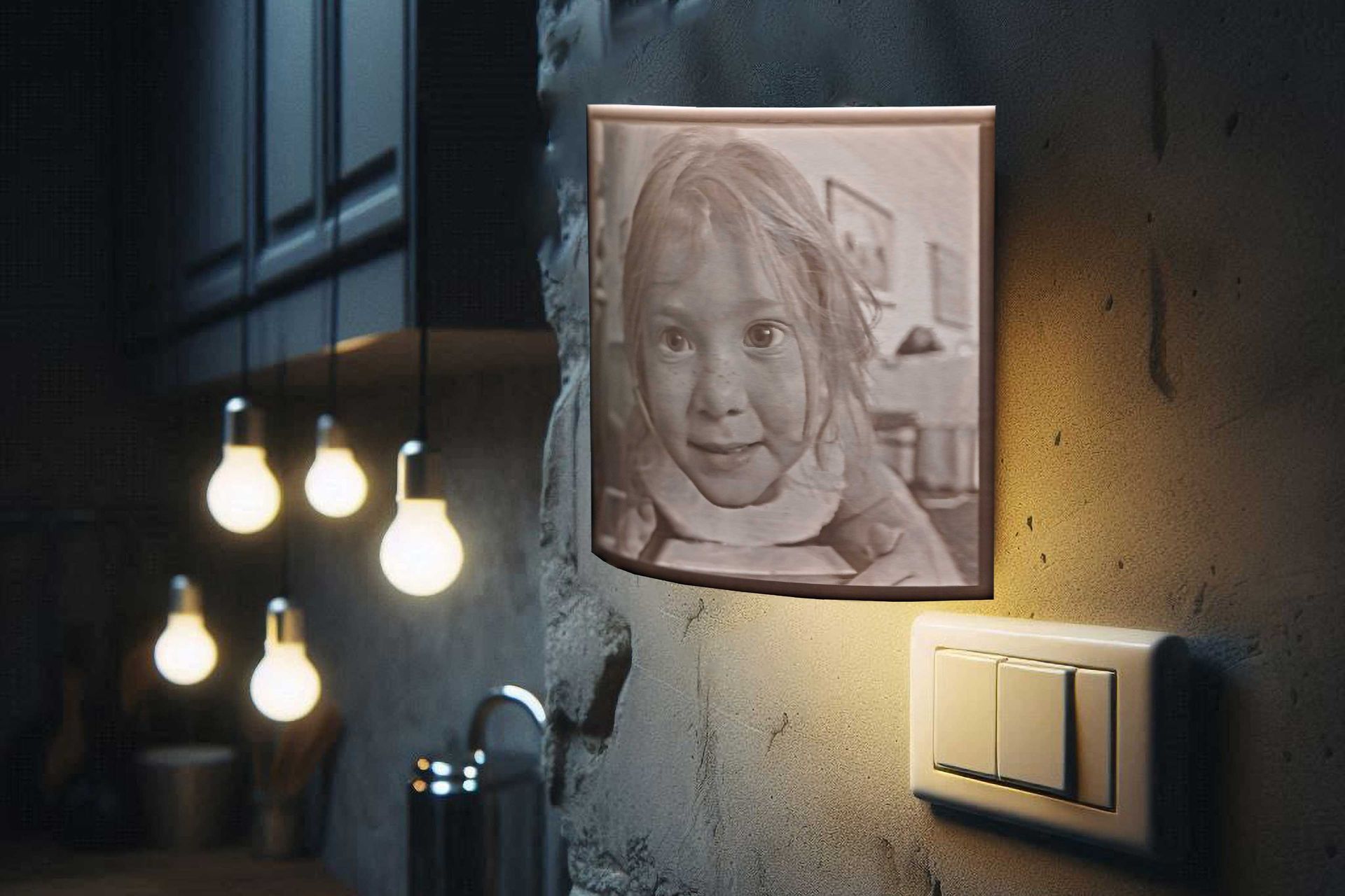 Framed pencil portrait on a wall beside hanging bulbs and a light switch in a dim room