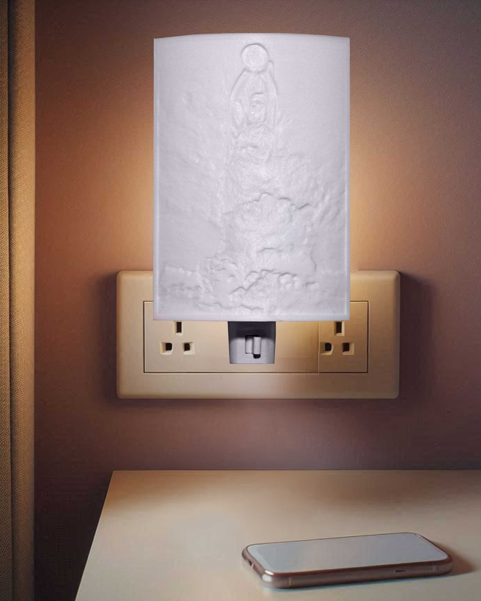 Wall outlet with a plugged-in night light behind a white paper towel in a dim room.