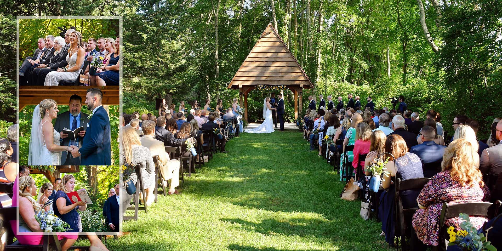 Outdoor wedding ceremony in a wooded venue, with guests seated along a grass aisle facing a decorated archway.