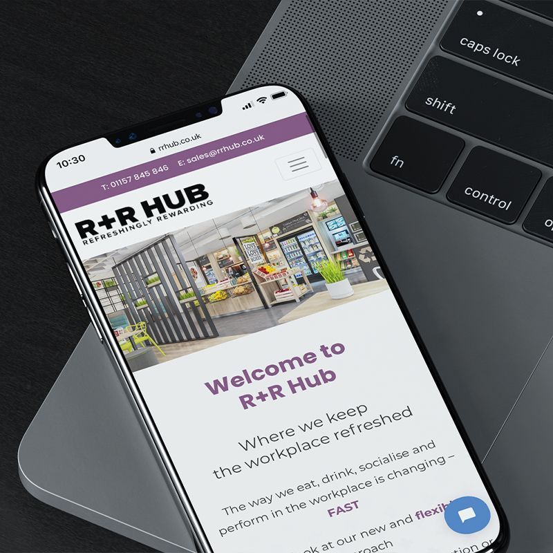 image-of-phone-on-laptop-showing-website-design
