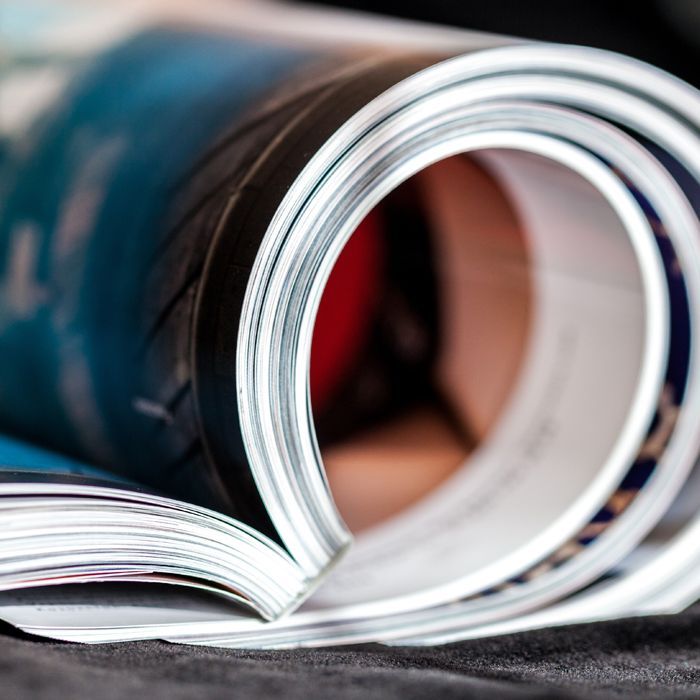 a close up of a rolled up magazine on a table