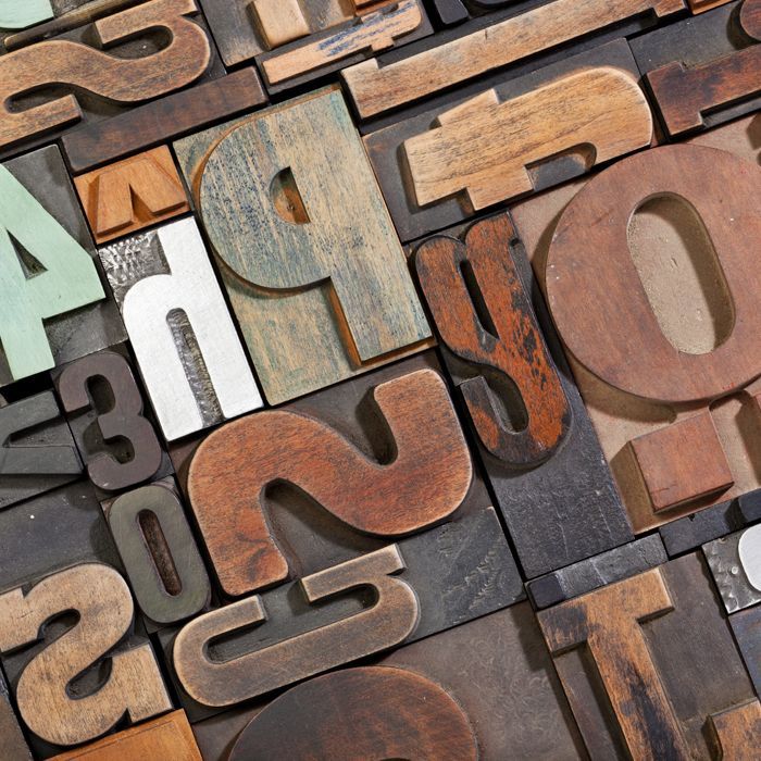 a bunch of wooden letters including