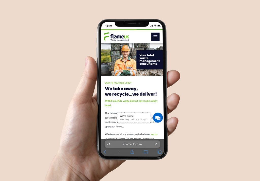 A hand holding a phone displaying a website for a recycling company.