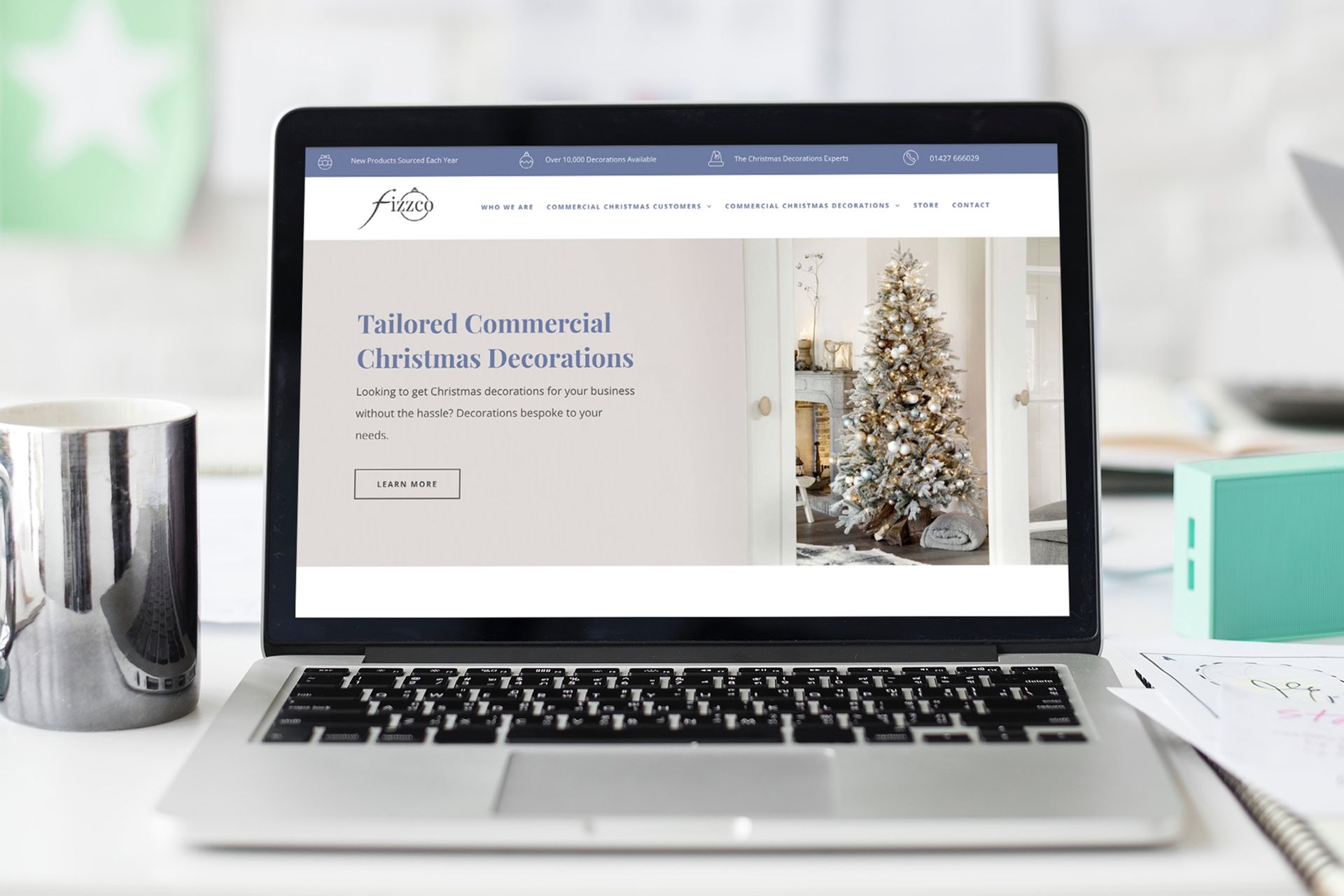 Laptop displaying a website for tailored Christmas decorations.