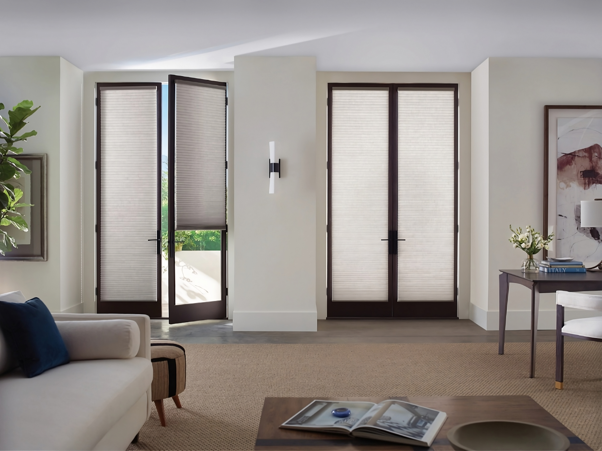Hunter Douglas Duette® Cellular Shades on two sets of French doors in a chic living room