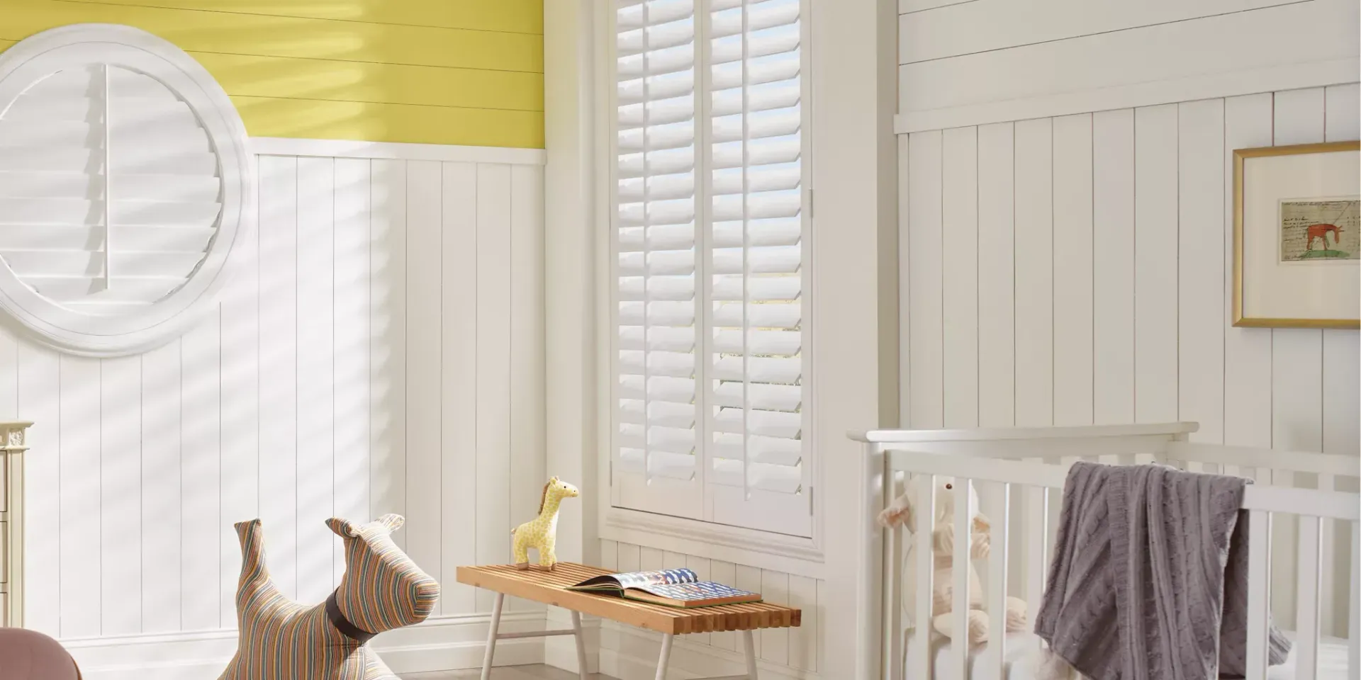 Child’s bedroom with Hunter Douglas Heritance® Hardwood Shutters decorating the window