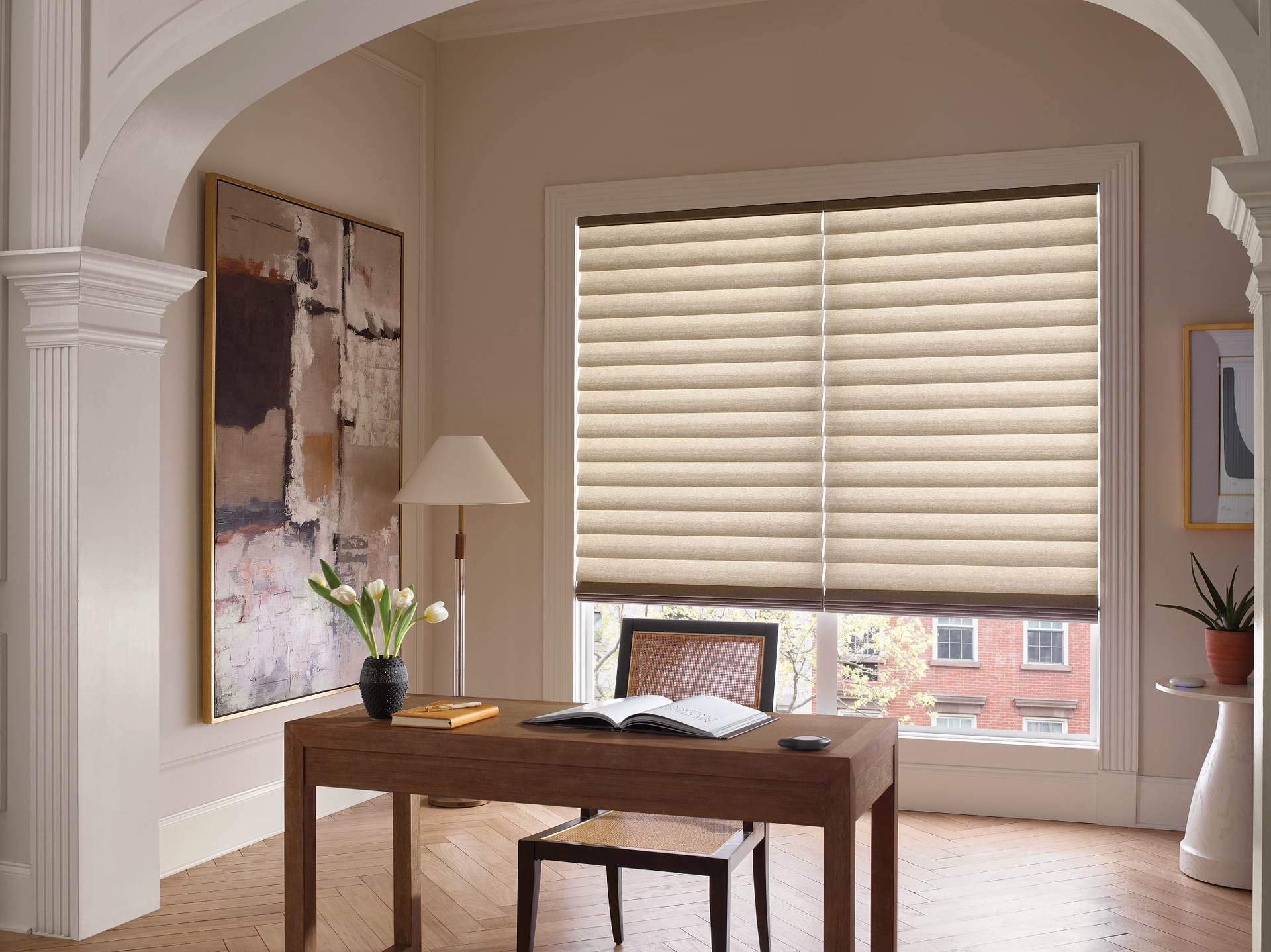 Roman shades paired with Hunter Douglas PowerView® Automation as home office shades in a minimalist 