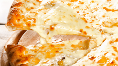 Cheesy toasted sandwich or quesadilla with melted cheese stretching across the filling