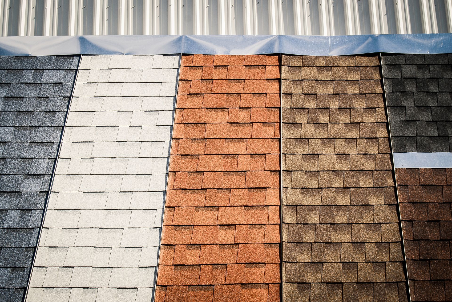 Roof shingle color samples in shades of gray, white, orange, brown, and dark brown.