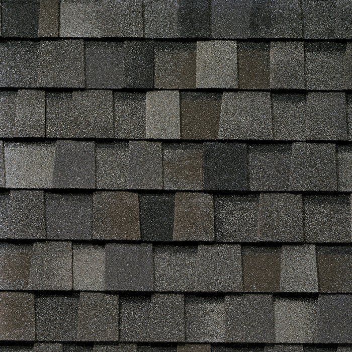 Dark gray asphalt roofing shingles.