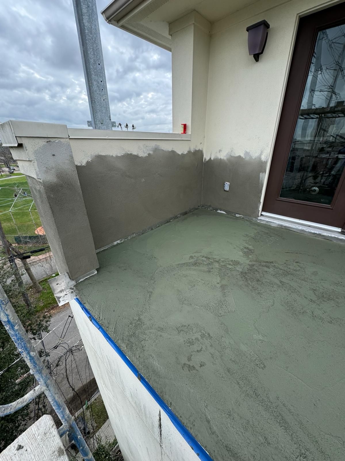 A balcony is being built on the side of a house.