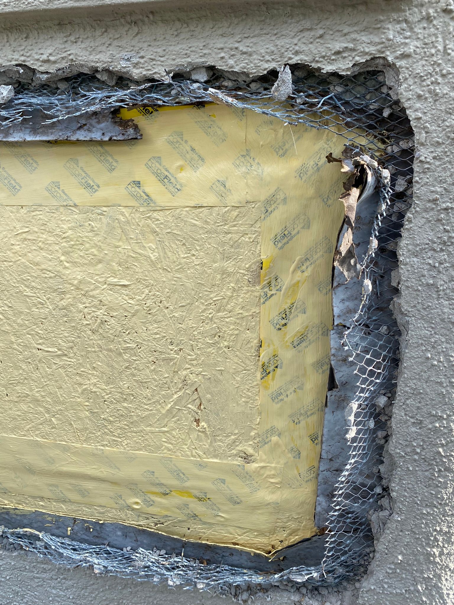 A close up of a piece of foam sitting on top of a concrete surface.