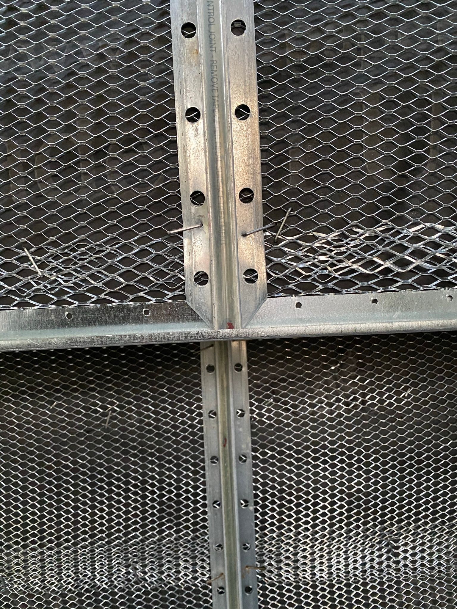 A close up of a metal structure with holes in it.