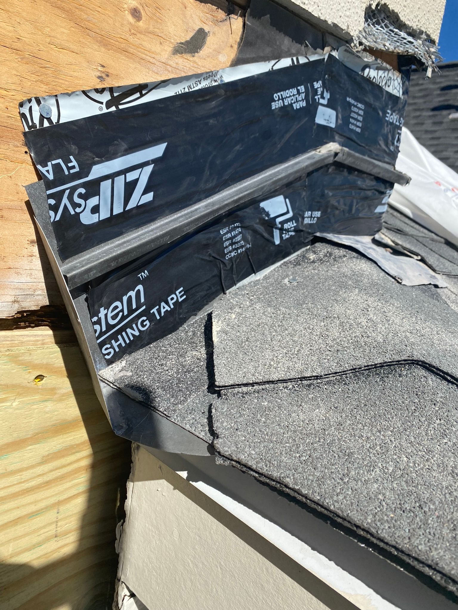 A piece of shingle tape is sitting on top of a roof.
