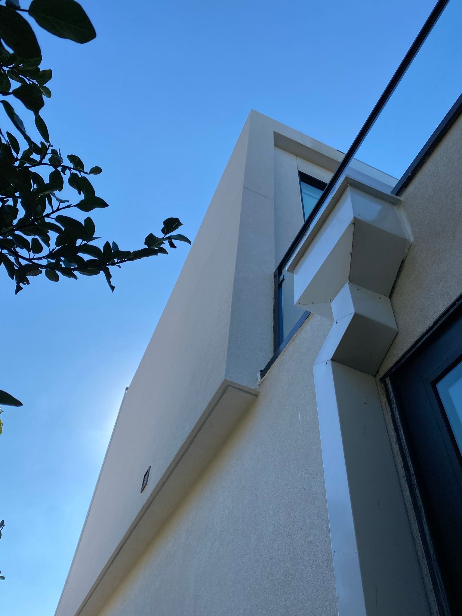 Looking up at a building with a blue sky in the background