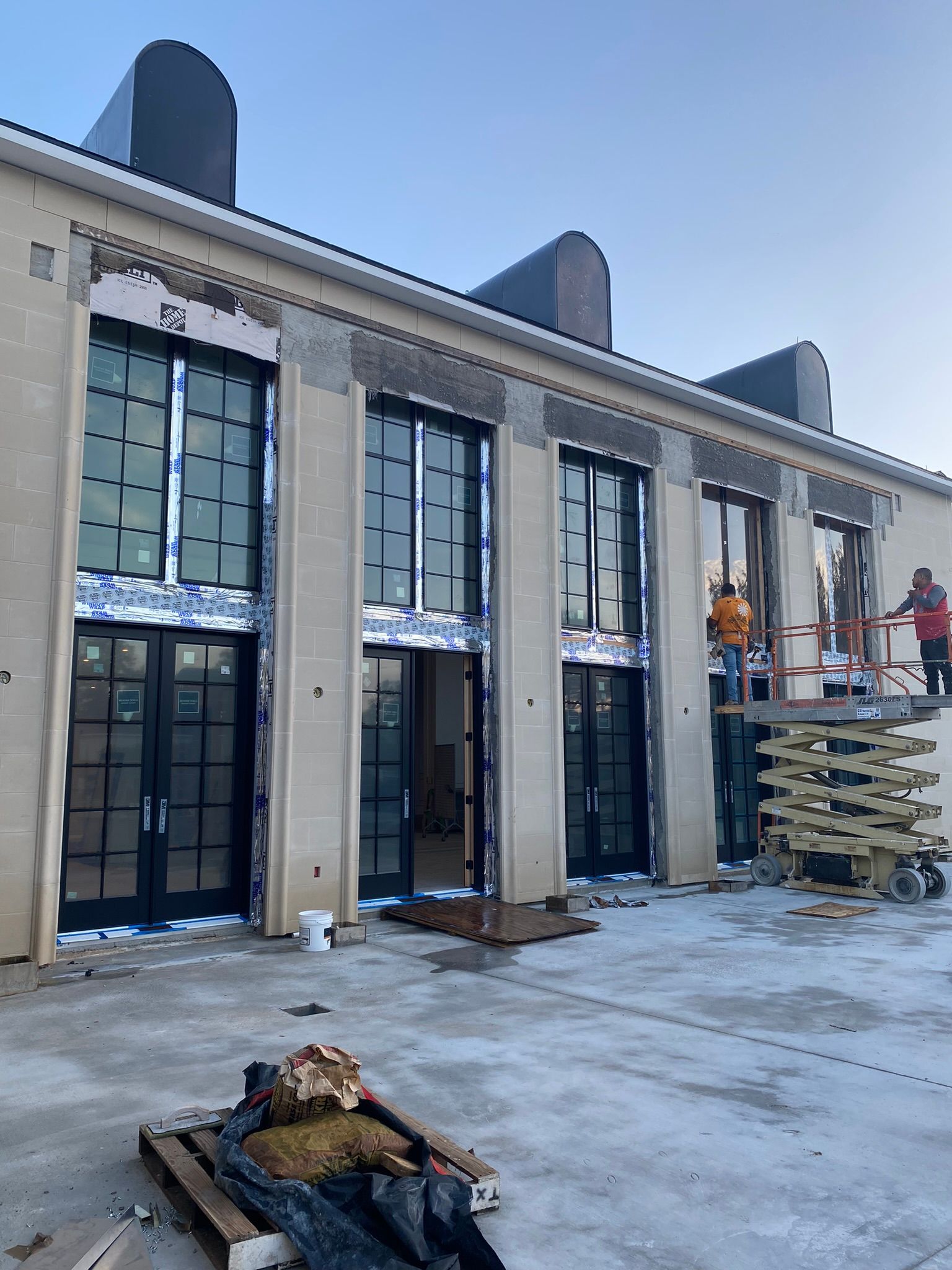 A large building with a lot of windows is being built.