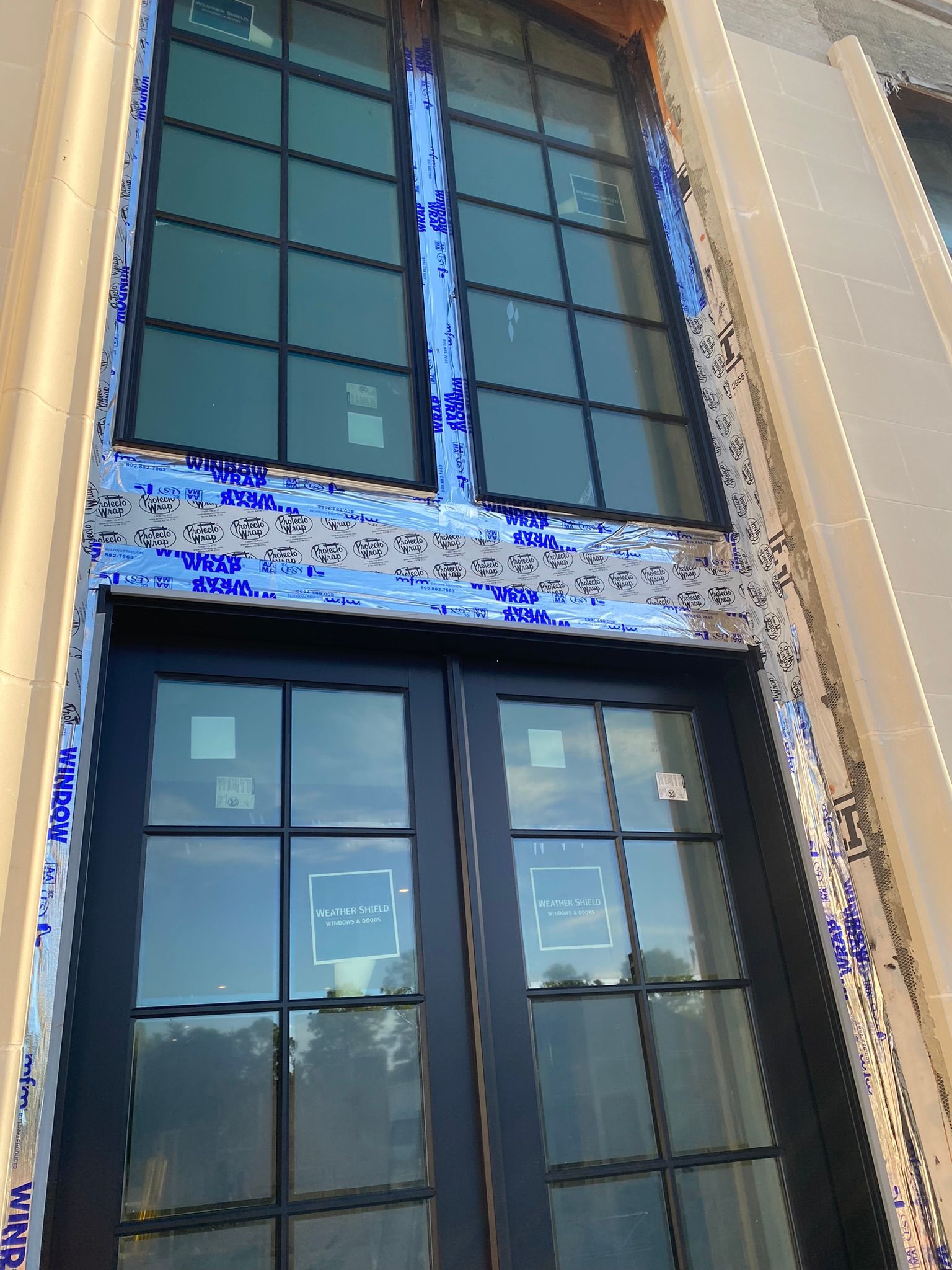A building with a lot of windows is being built.