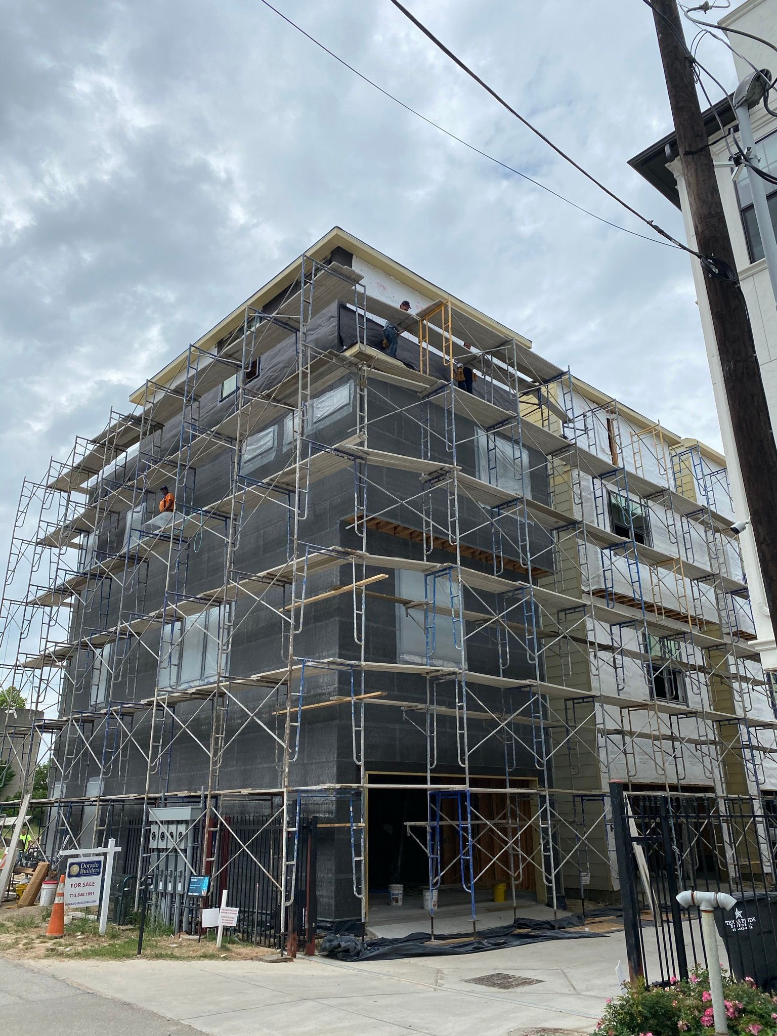 A large building under construction with scaffolding around it.