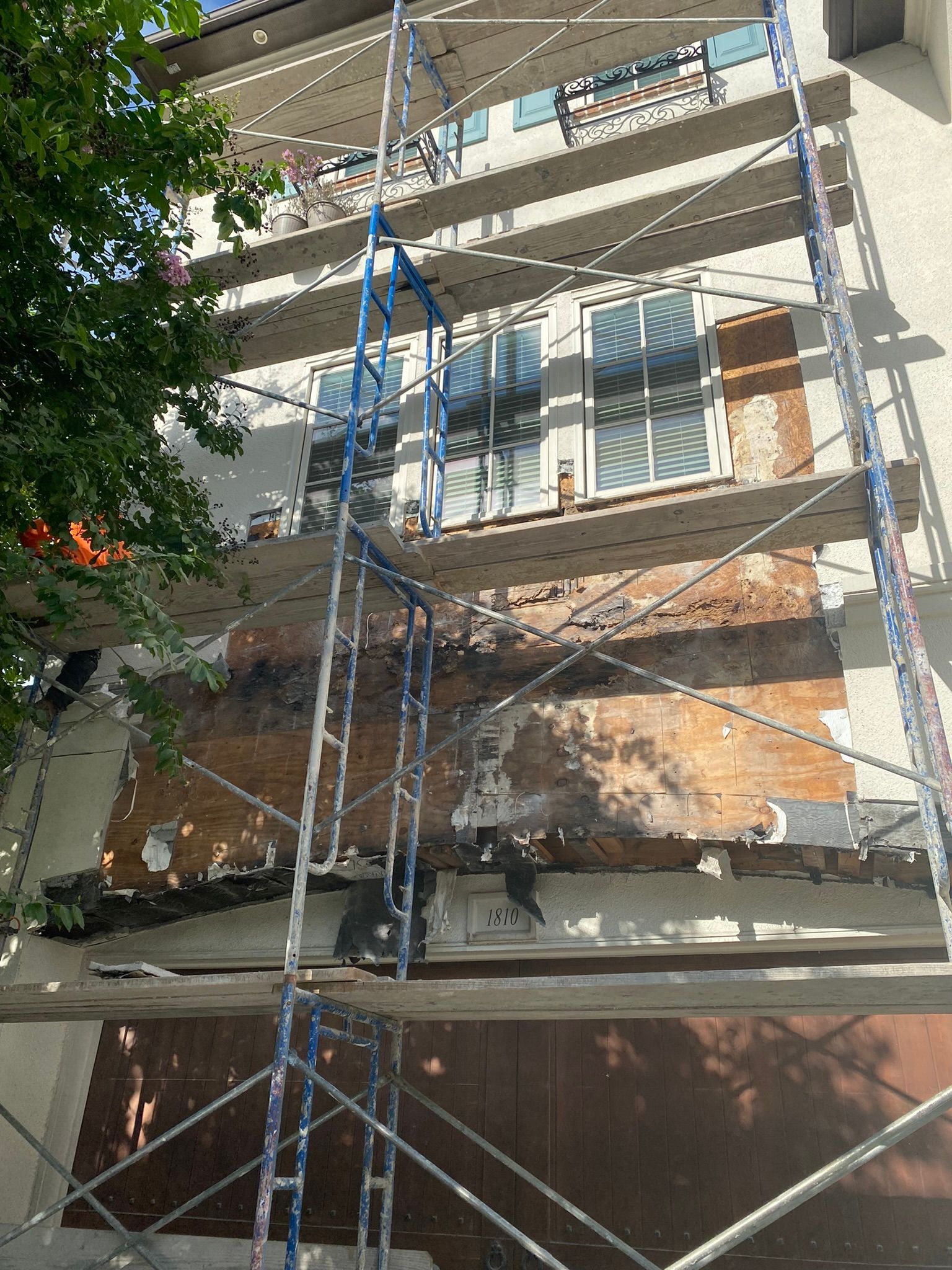 A building under construction with scaffolding on the side of it.
