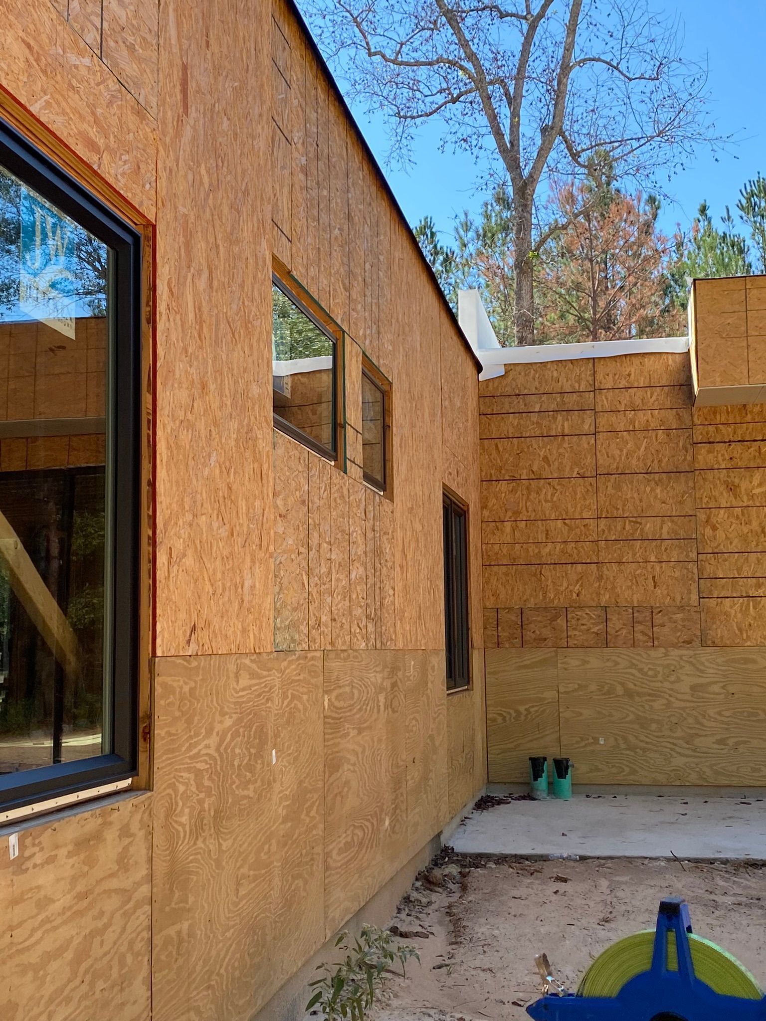 A house with a lot of windows on the side of it.