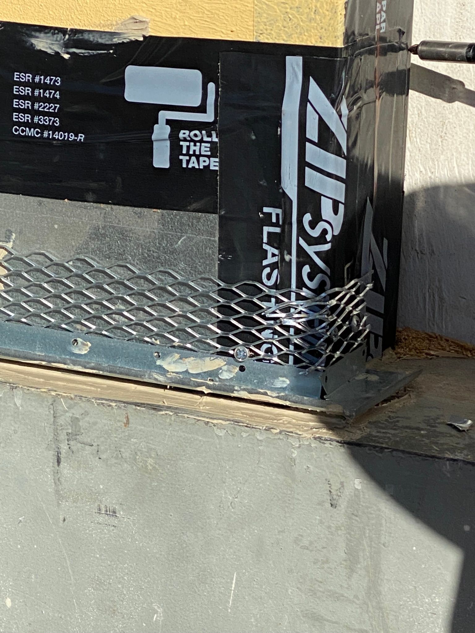 A piece of black tape that says zip system on it