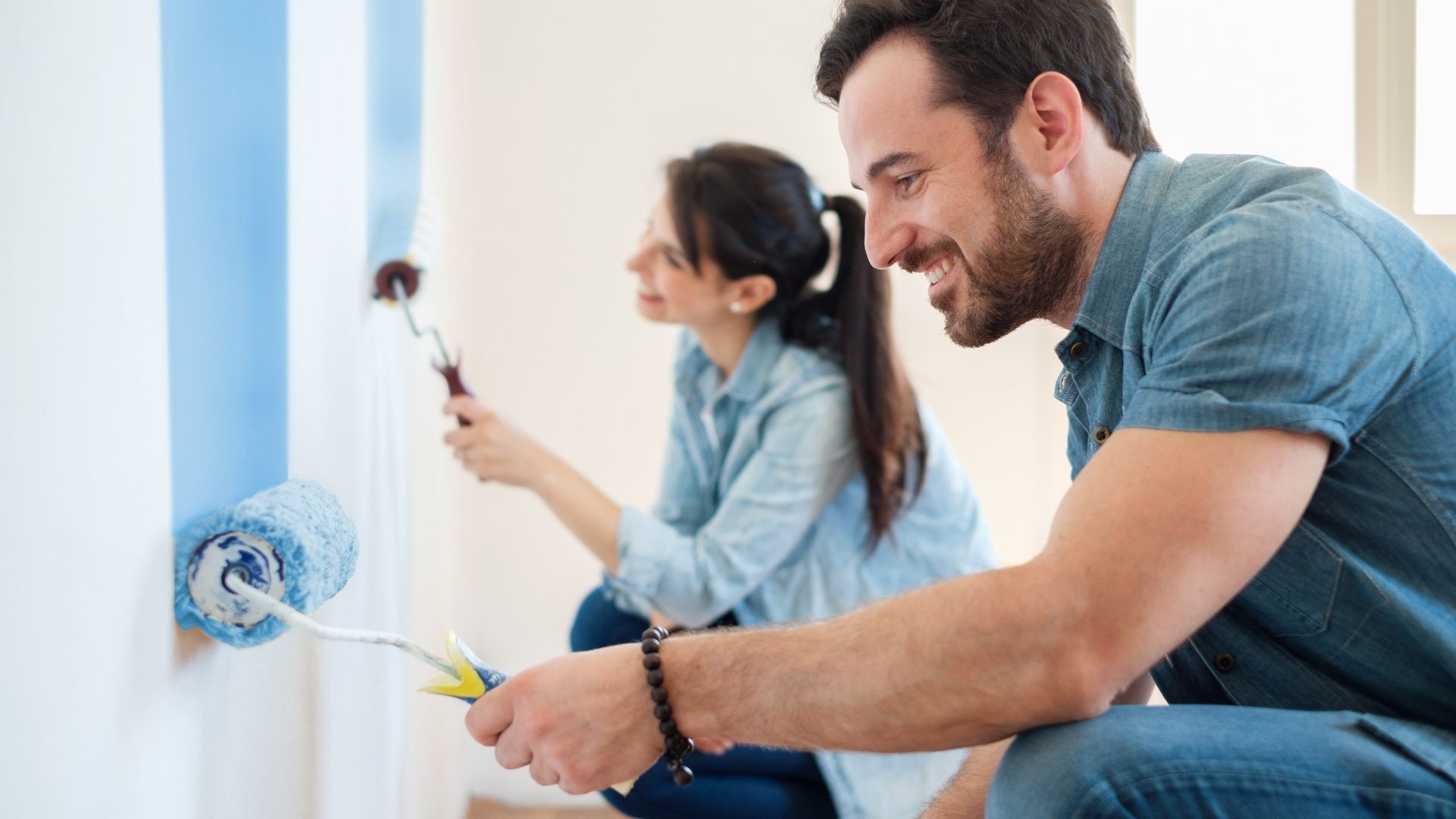 Two people sitting and trying different home interior styles