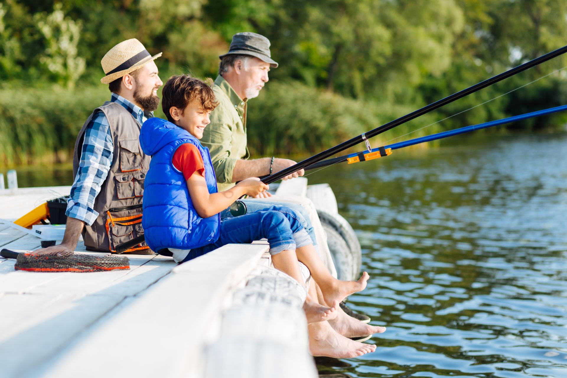 A family is fishing on a boat on a lake.