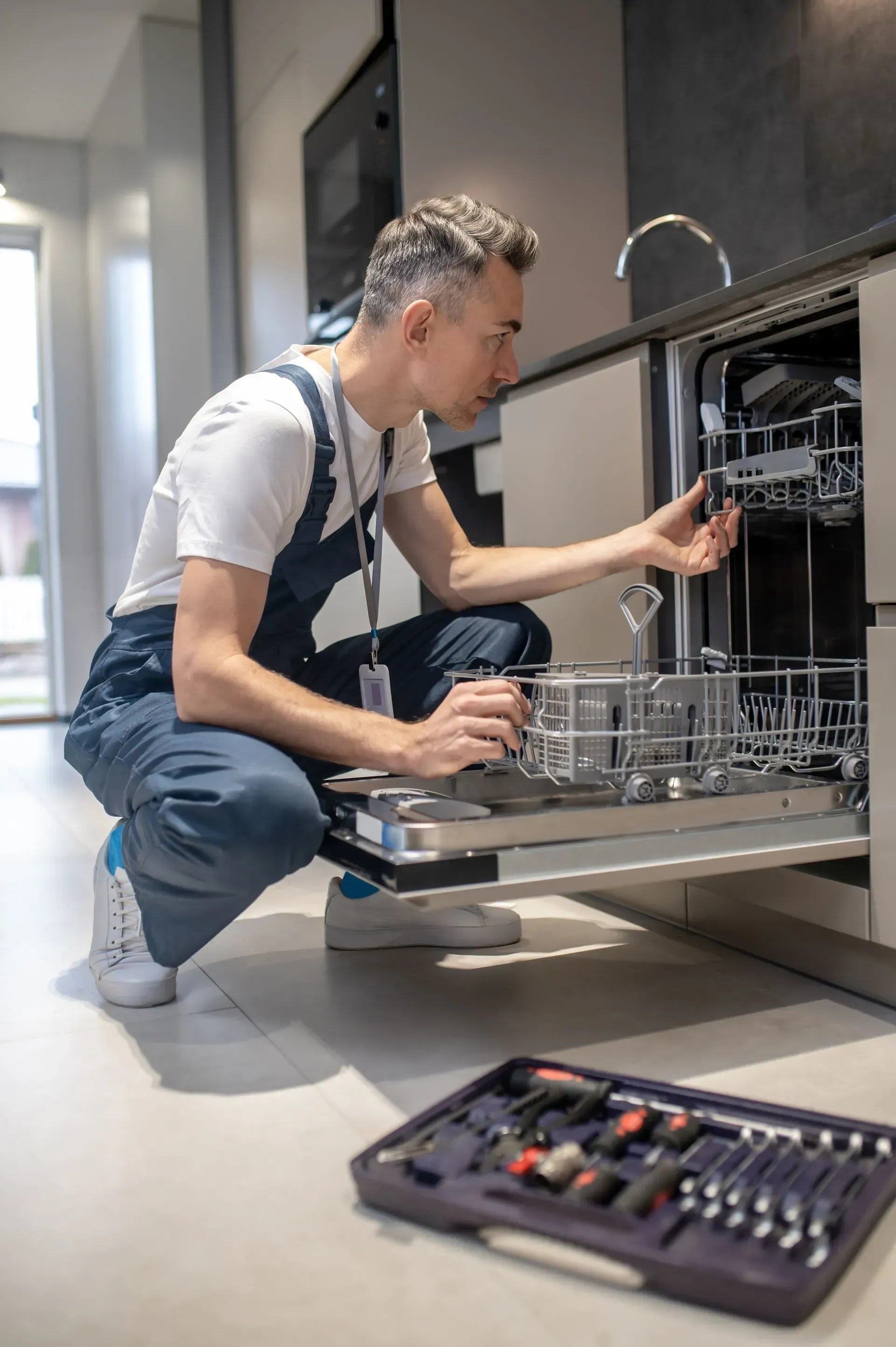 Plumber fixing sink
