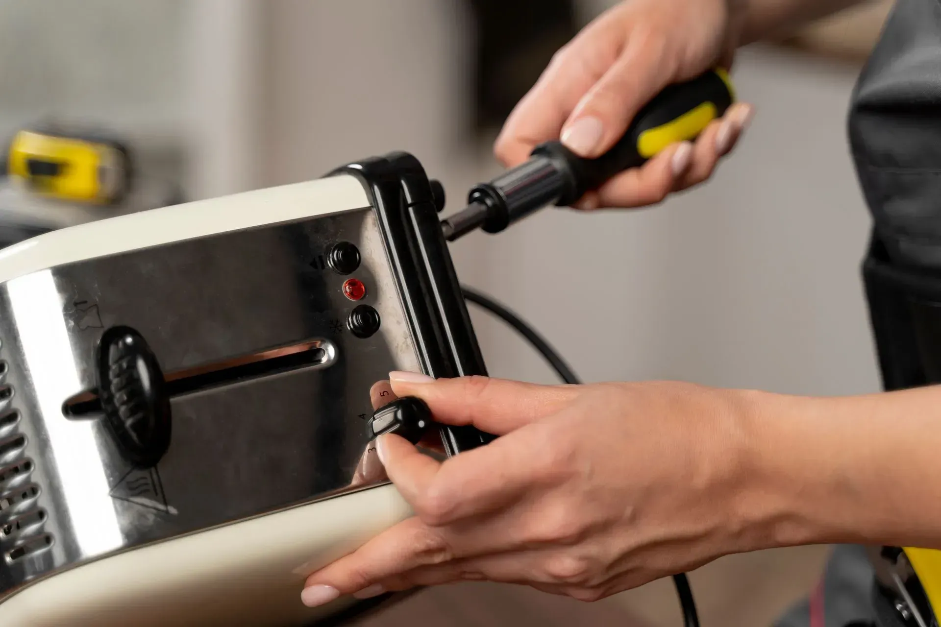 Man repairing toaster