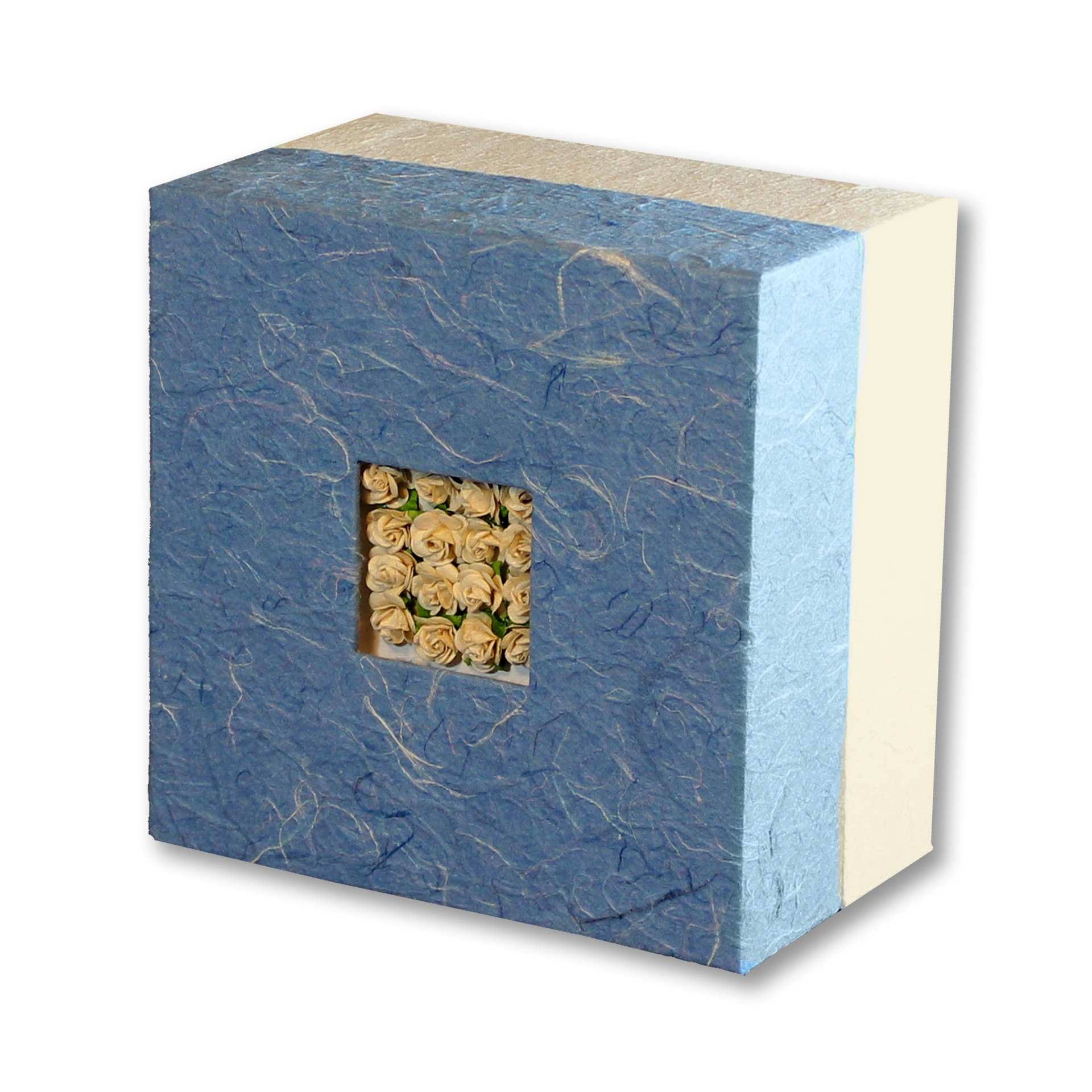Blue and white square box with a recessed square holding cream-colored flowers.