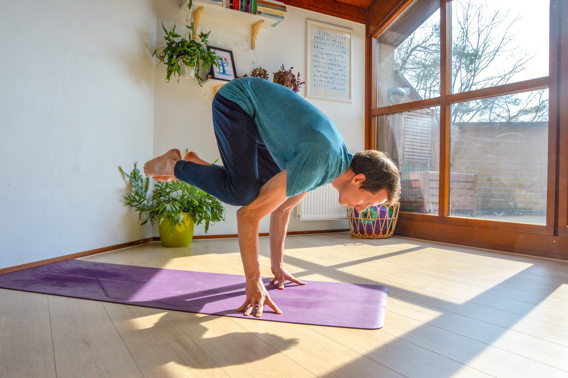 Yoga crow pose on finger tips